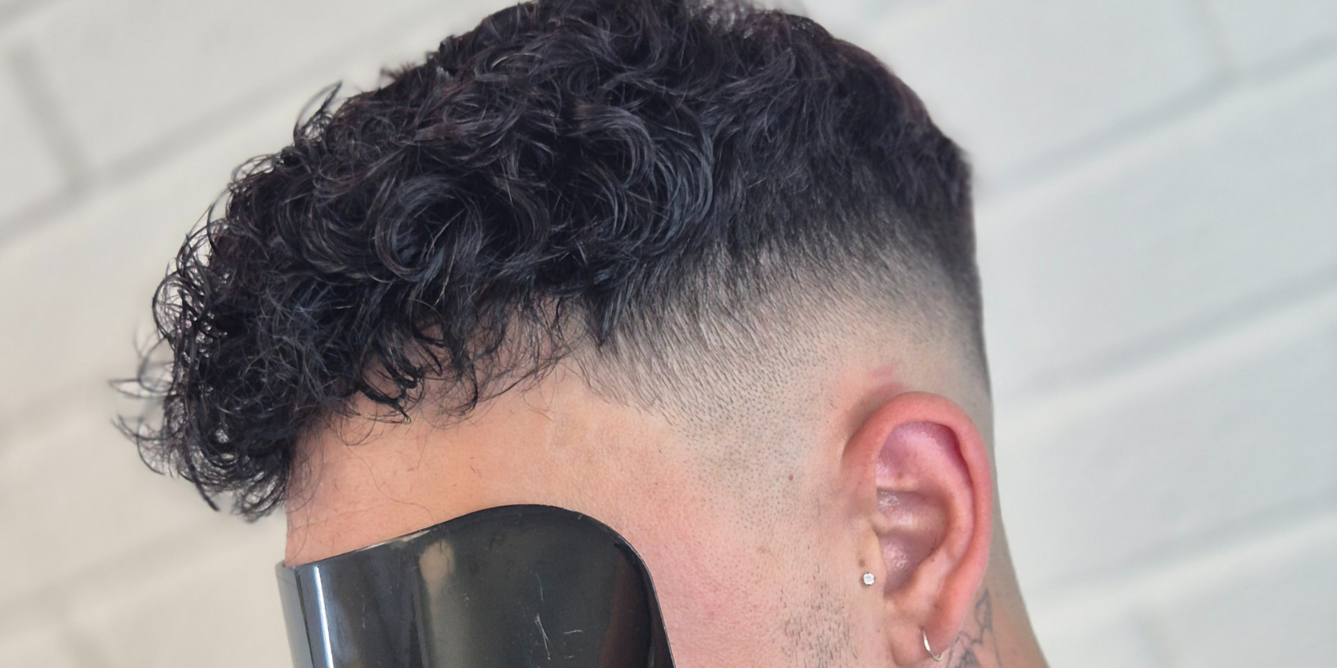 Curly hair system fitted and styled