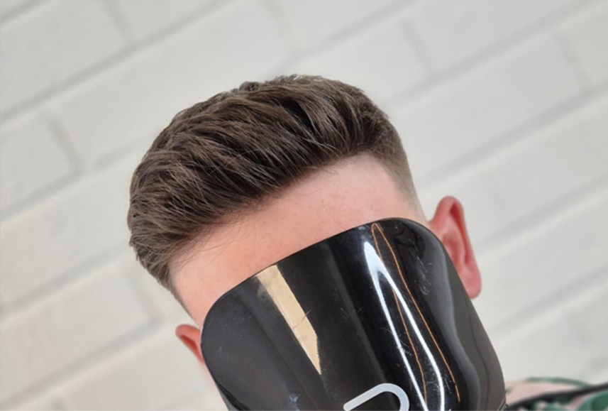 Side part hair system styled neatly